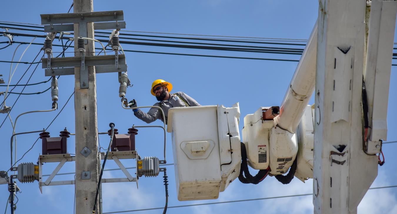 Bucket truck workers overhead electrical lines